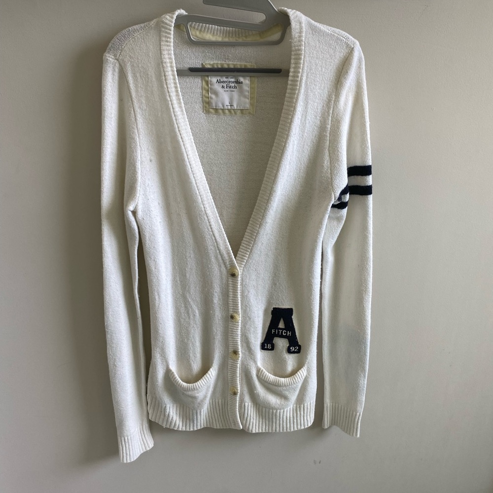 A&F cardigan with Dark blue detail. Soft wool like material. Off white color.